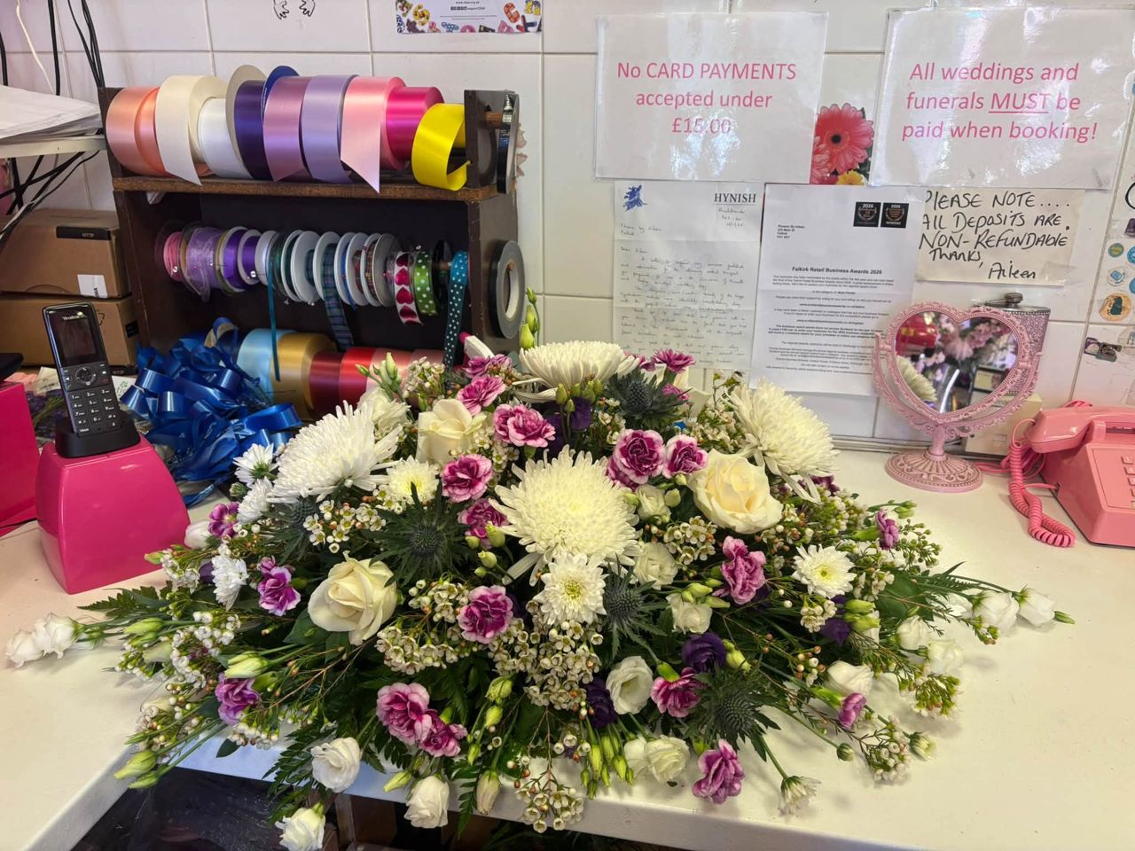 Lilac and white arrangement on the shop counter