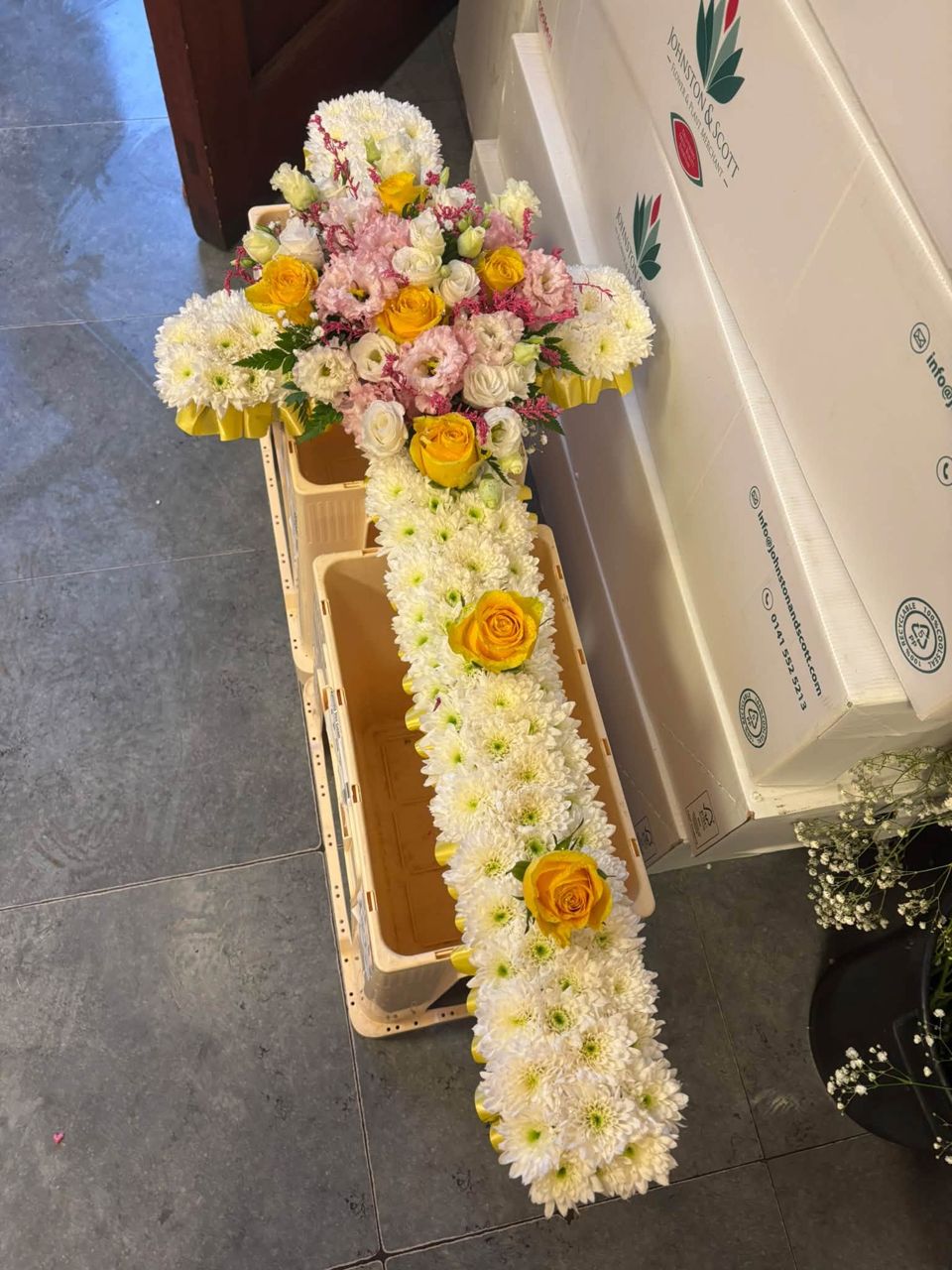 Cross tribute in white chrysanthemums with a floral spray