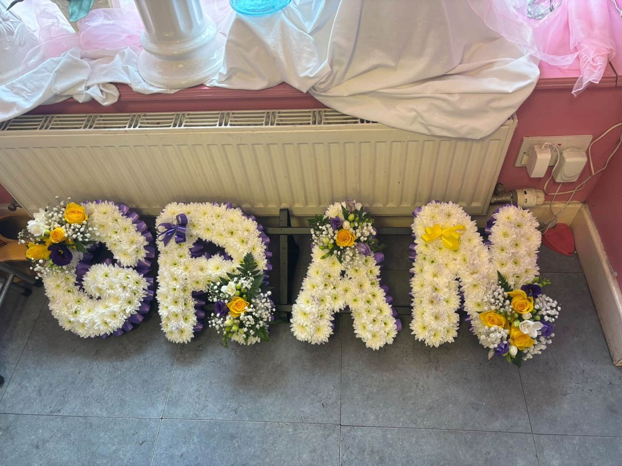 GRAN funeral letters in white chrysanthemums with posy accents